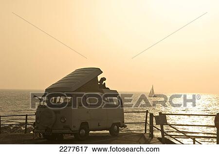 A Volkswagen camper van parked along the seafront; Broadstairs, Kent, England View Large Photo Image Stock Photo - A Volkswagen camper van parked along the seafront; Broadstairs, Kent, England. Fotosearch