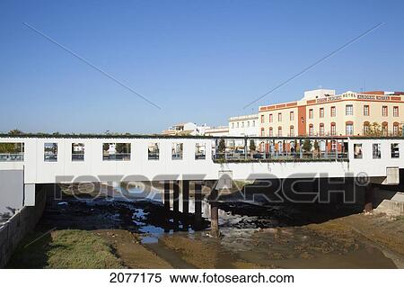 A Walkway Crossing Over A Waterway; Chiclana De La Frontera Andalusia Spain View Large Photo Image Stock Photography - A Walkway Crossing Over A Waterway; Chiclana De La Frontera Andalusia Spain. Fotosearch