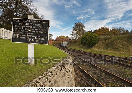 Stock Photo - A Warning Sign On The Side Of The Railway Tracks; Beamish, Durham, England. Fotosearch