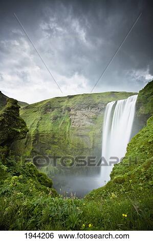 A Waterfall Over A Grassy Cliff; Skogarfoss Iceland View Large Photo Image Stock Photograph - A Waterfall Over A Grassy Cliff; Skogarfoss Iceland. Fotosearch