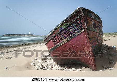 A Weathered Wooden Boat On The Beach; Cape Trafalgar Andalusia Spain View Large Photo Image Picture - A Weathered Wooden Boat On The Beach; Cape Trafalgar Andalusia Spain. Fotosearch