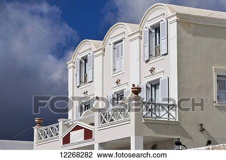 A white house with open shutters on windows; Fira, Santorini, Cyclades, Greek Islands, Greece View Large Photo Image Stock Image - A white house with open shutters on windows; Fira, Santorini, Cyclades, Greek Islands, Greece. Fotosearch