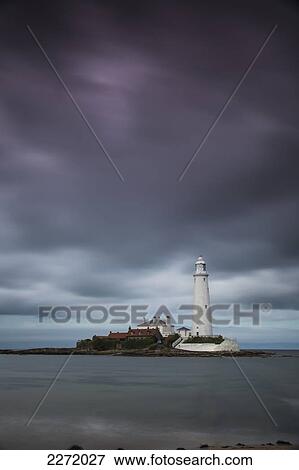 A White Lighthouse Under Storm Clouds; St. Mary's Island Northumberland England View Large Photo Image Stock Photo - A White Lighthouse Under Storm Clouds; St. Mary's Island Northumberland England. Fotosearch