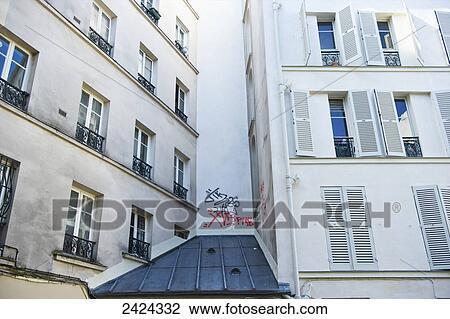 A white residential building with graffiti on the exterior wall; Paris, France View Large Photo Image Stock Image - A white residential building with graffiti on the exterior wall; Paris, France. Fotosearch