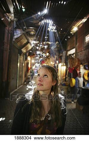 A Woman Browsing Around Market Stalls In The Souk. View Large Photo Image Picture - A Woman Browsing Around Market Stalls In The Souk.. Fotosearch