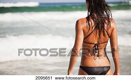 A Woman In A Black Bikini At The Ocean; Gold Coast Queensland Australia View Large Photo Image Stock Image - A Woman In A Black Bikini At The Ocean; Gold Coast Queensland Australia. Fotosearch