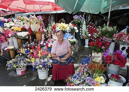 Stock Photo - A woman selling flowers; Kiev, Ukraine. Fotosearch
