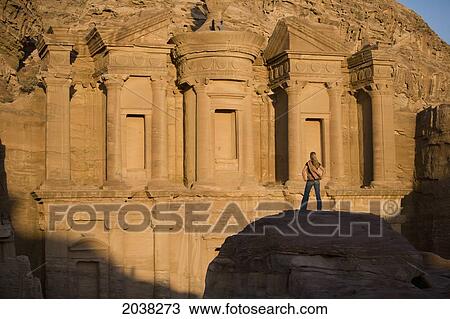 A Woman Tourist Visits The Nabatean Ruins Of The Monastery; Petra Jordan View Large Photo Image Stock Image - A Woman Tourist Visits The Nabatean Ruins Of The Monastery; Petra Jordan. Fotosearch