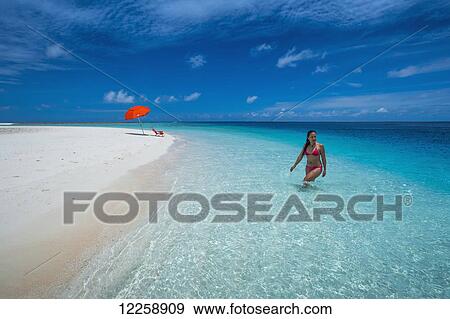A woman wading in the pristine waters; Marshall Islands View Large Photo Image Stock Photo - A woman wading in the pristine waters; Marshall Islands. Fotosearch