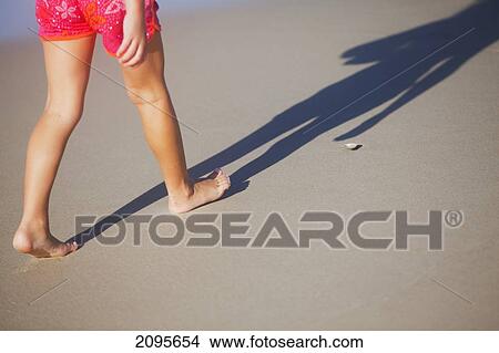 A Woman Walking In Bare Feet On The Sand; Gold Coast Queensland Australia View Large Photo Image Picture - A Woman Walking In Bare Feet On The Sand; Gold Coast Queensland Australia. Fotosearch