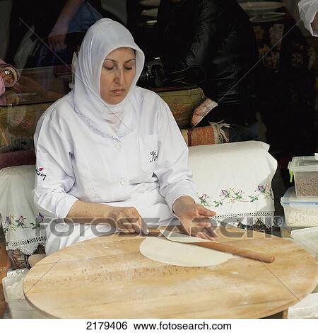 A Woman Working With Pastry In A Shop Window; Istanbul Turkey View Large Photo Image Stock Photograph - A Woman Working With Pastry In A Shop Window; Istanbul Turkey. Fotosearch