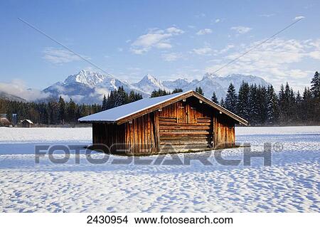 A wooden building in a snow covered field; Bayern, Germany View Large Photo Image Picture - A wooden building in a snow covered field; Bayern, Germany. Fotosearch