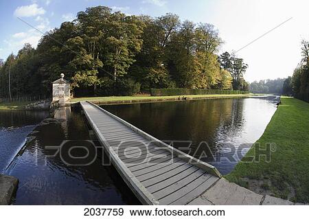 Stock Photo - A Wooden Walkway Crossing The River; North Yorkshire England. Fotosearch