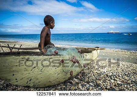 A young boy watching a cruise ship arrive; Pentecost Island, Vanuatu View Large Photo Image Stock Image - A young boy watching a cruise ship arrive; Pentecost Island, Vanuatu. Fotosearch