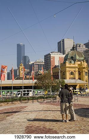 A Young Couple Admire The View From Federation Square, Melbourne, Victoria, Australia View Large Photo Image Stock Image - A Young Couple Admire The View From Federation Square, Melbourne, Victoria, Australia. Fotosearch