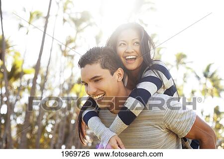 Stock Photograph - A young couple spending quality time together. Fotosearch
