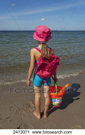 A young girl on the beach; Rugen, Germany View Large Photo Image Stock Image - A young girl on the beach; Rugen, Germany. Fotosearch