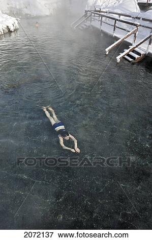 Stock Photo - A Young Girl Swimming In Hot Springs In Mid Winter, Liard River Hot Springs, Northern British Columbia. Fotosearch