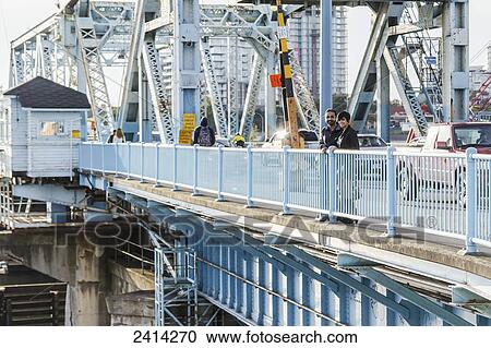 A young Indian ethnicity couple on historical Johnson Street Bridge; Victoria, Vancouver Island, British Columbia View Large Photo Image Stock Image - A young Indian ethnicity couple on historical Johnson Street Bridge; Victoria, Vancouver Island, British Columbia. Fotosearch
