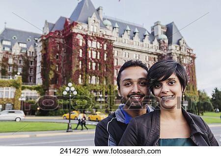 A young Indian ethnicity couple poses in front of the Fairmont Empress Hotel; Victoria, Vancouver Island, British Columbia View Large Photo Image Stock Photograph - A young Indian ethnicity couple poses in front of the Fairmont Empress Hotel; Victoria, Vancouver Island, British Columbia. Fotosearch