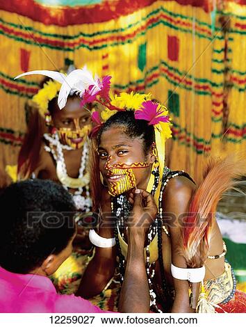 A young Mekeo woman prepares for a cultural performance; Central Province, Papua New Guinea View Large Photo Image Stock Photo - A young Mekeo woman prepares for a cultural performance; Central Province, Papua New Guinea. Fotosearch