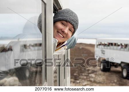 A Young Woman Looks Out The Window Of A Tundra Vehicle On A Polar Bear Expedition; Churchill Manitoba Canada View Large Photo Image Stock Photograph - A Young Woman Looks Out The Window Of A Tundra Vehicle On A Polar Bear Expedition; Churchill Manitoba Canada. Fotosearch