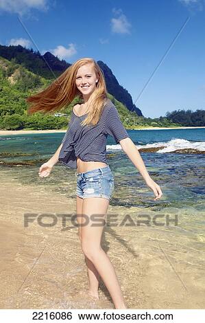 A young woman on Tunnel's beach; Kauai, Hawaii, United States of America View Large Photo Image Stock Photograph - A young woman on Tunnel's beach; Kauai, Hawaii, United States of America. Fotosearch