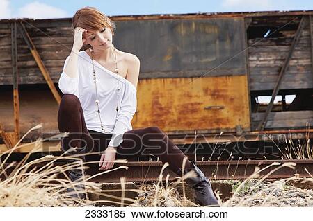 A young woman poses on train tracks; Honolulu, Oahu, Hawaii, United States of America View Large Photo Image Stock Photography - A young woman poses on train tracks; Honolulu, Oahu, Hawaii, United States of America. Fotosearch