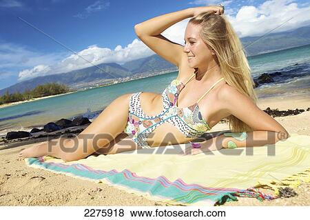 A young woman posing on the beach of an hawaiian island; Maui, Hawaii, United States of America View Large Photo Image Stock Photo - A young woman posing on the beach of an hawaiian island; Maui, Hawaii, United States of America. Fotosearch
