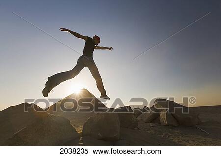 A Young Woman Tourist Jumps In The Air At The Red Pyramid; Dashur Egypt View Large Photo Image Stock Photography - A Young Woman Tourist Jumps In The Air At The Red Pyramid; Dashur Egypt. Fotosearch