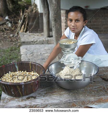 A Young Woman Using A Grater For Food; Copan, Honduras View Large Photo Image Stock Image - A Young Woman Using A Grater For Food; Copan, Honduras. Fotosearch