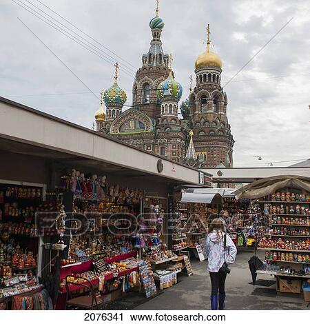 A Young Woman Walks Through A Market Area With The Church Of The Savior On Spilled Blood In The Background; St. Petersburg Russia View Large Photo Image Stock Image - A Young Woman Walks Through A Market Area With The Church Of The Savior On Spilled Blood In The Background; St. Petersburg Russia. Fotosearch