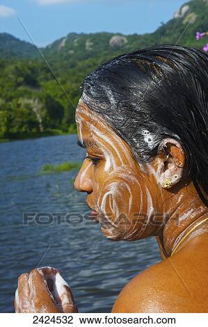 A young woman washes her face in a river; Ulpotha, Embogama, Sri Lanka View Large Photo Image Stock Image - A young woman washes her face in a river; Ulpotha, Embogama, Sri Lanka. Fotosearch
