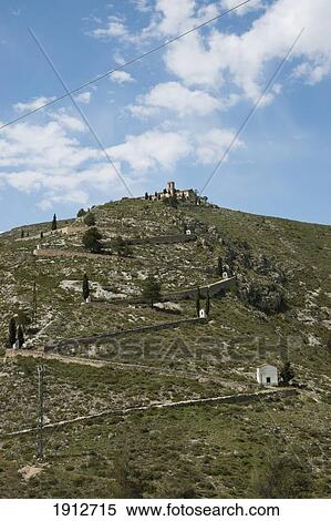 Stock Photography - A Zigzag Path Leading To The Chapel Of The Holy Christ On A Hilltop; Bocairent, Valencia, Spain. Fotosearch