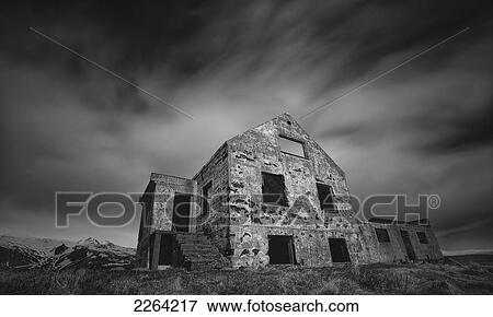 Stock Photo - Abandoned brick house sitting on the shoreline of the snaefellsnes peninsula; iceland. Fotosearch