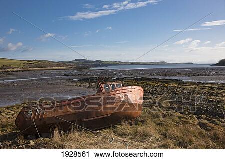 Stock Image - Abandoned Dilapidated Boat; Dumfries, Scotland. Fotosearch