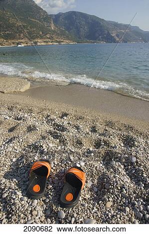 Abandoned Flip Flops On A Pebbly Beach, The National Park, Oludeniz At The Turquoise Coast, Southern Turkey View Large Photo Image Stock Image - Abandoned Flip Flops On A Pebbly Beach, The National Park, Oludeniz At The Turquoise Coast, Southern Turkey. Fotosearch