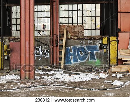 Stock Image - Abandoned, graffiti-filled industrial space; Montreal, Quebec, Canada. Fotosearch