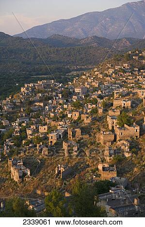 Stock Image - Abandoned Town Of Kayakoy At Sunset; Turkey. Fotosearch
