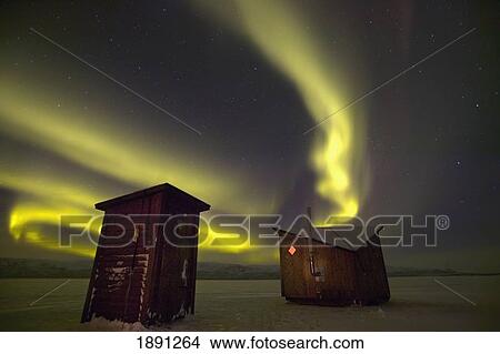 Picture - Abisko, Sweden. The Abisko Ark Hotel With The Aurora Borealis (Northern Lights) In The Background. Doug Mckinlay/Axiom. Fotosearch
