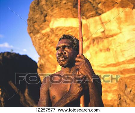 Aboriginal man with spear in Arnhem Land; Northern Territory, Australia View Large Photo Image Stock Photo - Aboriginal man with spear in Arnhem Land; Northern Territory, Australia. Fotosearch