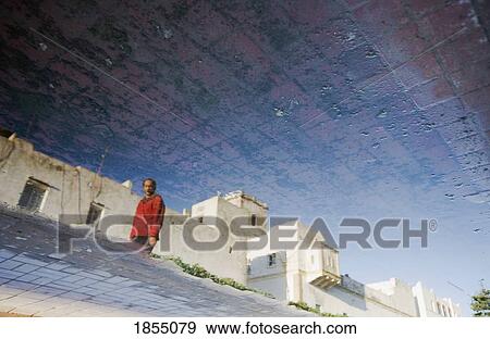 Abstract Of Man Walking Through Streets Of Essaouira, Morocco View Large Photo Image Stock Photo - Abstract Of Man Walking Through Streets Of Essaouira, Morocco. Fotosearch