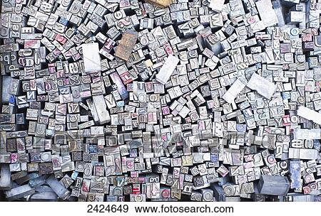 Stock Photo - Abundance of letter, number and symbolic stamps, Piccadilly Circus; London, England. Fotosearch