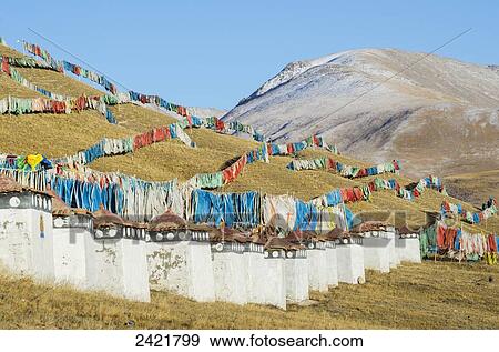 Abundance of prayer flags on a mountain slope at a Tibetan monastery near Hot Spring city; Madoi County, Tibet View Large Photo Image Stock Photo - Abundance of prayer flags on a mountain slope at a Tibetan monastery near Hot Spring city; Madoi County, Tibet. Fotosearch