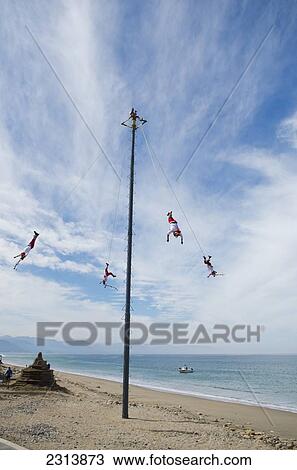 Acrobats performing on beach; Puerta Vallarta, Jalisco, Mexico View Large Photo Image Stock Image - Acrobats performing on beach; Puerta Vallarta, Jalisco, Mexico. Fotosearch