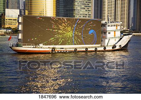 Stock Photograph - Advertising Boat On Huangpu River In The Bund Area; Shanghai, China. Fotosearch