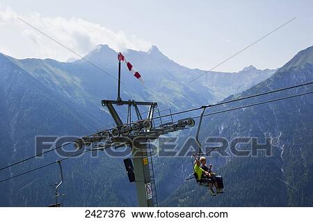 Aerial lift in the Alps, near Bach; Tirol, Austria View Large Photo Image Stock Photograph - Aerial lift in the Alps, near Bach; Tirol, Austria. Fotosearch