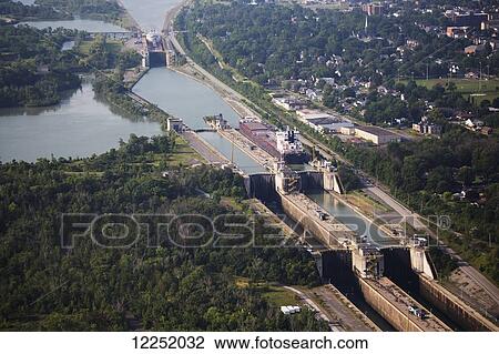 Stock Image - Aerial of the Welland Canal and ships in a series of canal locks; Thorold, Ontario, Canada. Fotosearch