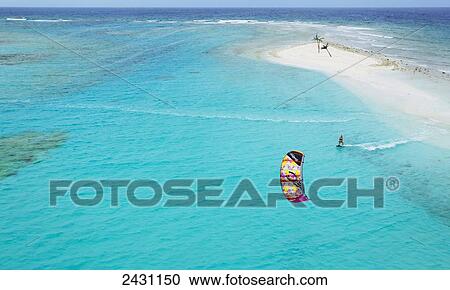 Aerial view from a helicopter of professional kiteboarder Susi Mai kitesurfing over the crystal blue waters; Necker Island, British Virgin Islands View Large Photo Image Stock Image - Aerial view from a helicopter of professional kiteboarder Susi Mai kitesurfing over the crystal blue waters; Necker Island, British Virgin Islands. Fotosearch