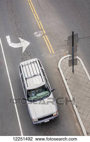 Stock Image - Aerial view of a car on the street in the turning lane; Connecticut, United States of America. Fotosearch